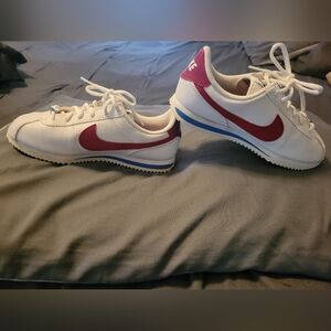 Nike Kids White, Red, And Blue Sneakers.